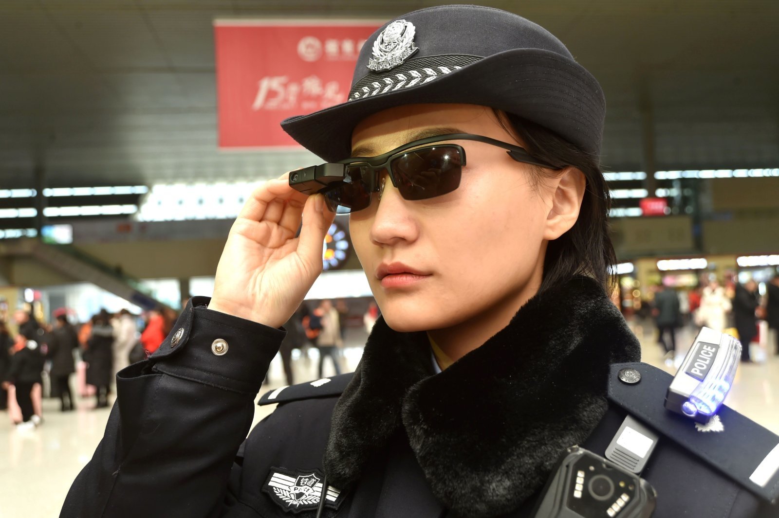 An officer using facial recognition glasses in Beijing